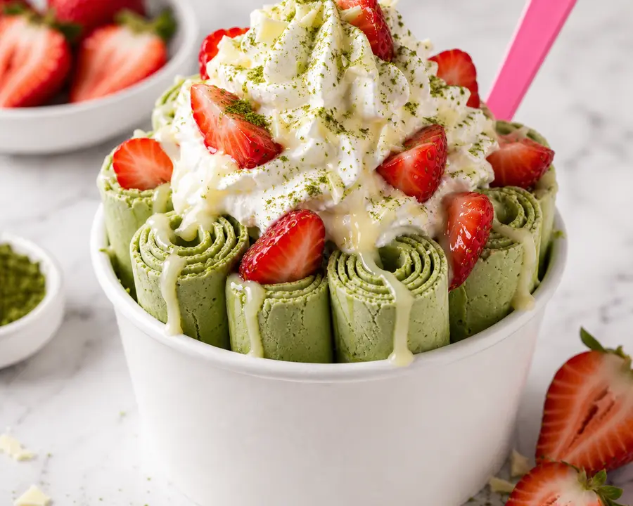 Mighty Matcha rolled ice cream with matcha, strawberry, and white drizzle